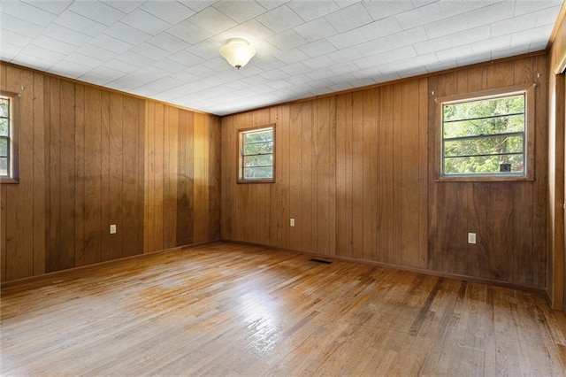 66 Mccoy Ave, Satsuma, AL 36572 - spare room featuring wood-type flooring and wooden walls