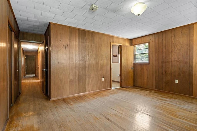 66 Mccoy Ave, Satsuma, AL 36572 - spare room with light wood-style flooring, wooden walls, and baseboards