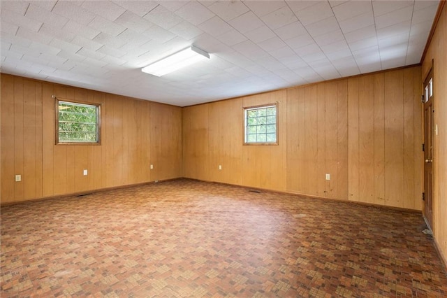 66 Mccoy Ave, Satsuma, AL 36572 - unfurnished room featuring baseboards and wood walls