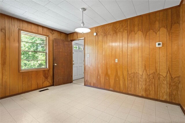 66 Mccoy Ave, Satsuma, AL 36572 - unfurnished room with light flooring and wood walls
