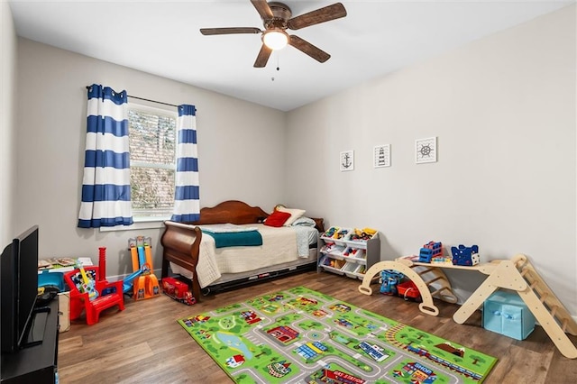 bedroom featuring ceiling fan and wood finished floors