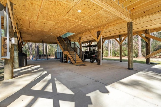 exterior space with stairs and a carport