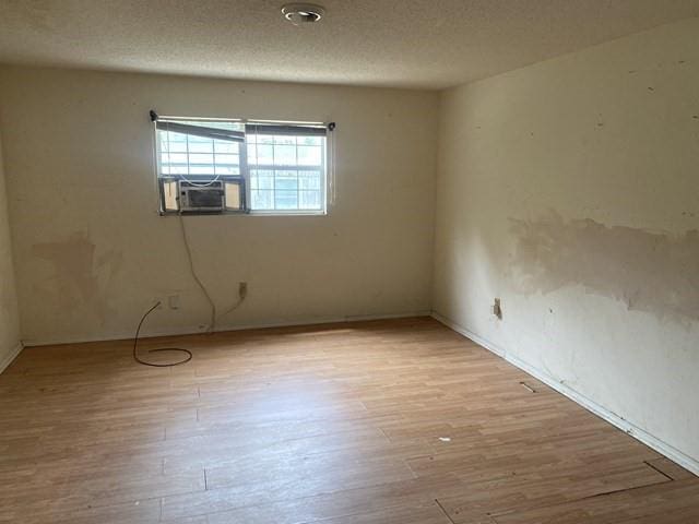 351 Lincoln Blvd, Mobile, AL 36608 - unfurnished room with light wood-style flooring, cooling unit, and baseboards