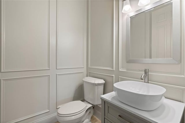 6060 Riverchase Dr S, Mobile, AL 36619 - half bath featuring vanity and a decorative wall