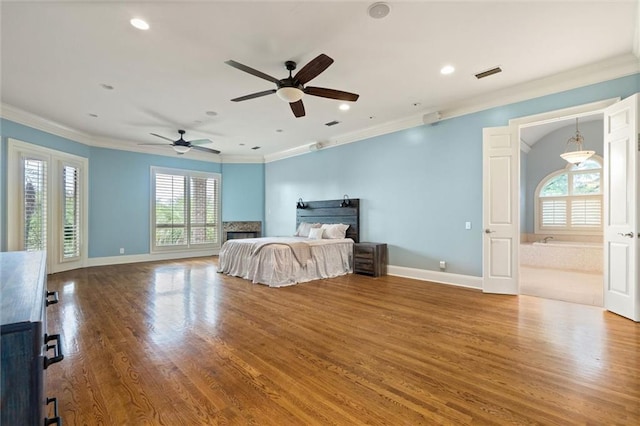 6060 Riverchase Dr S, Mobile, AL 36619 - bedroom featuring ornamental molding, wood finished floors, recessed lighting, a fireplace, and a ceiling fan