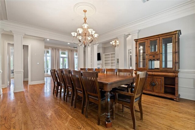 6060 Riverchase Dr S, Mobile, AL 36619 - dining room with ornamental molding, a chandelier, light wood-style floors, and ornate columns