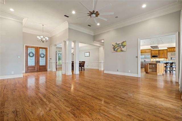 6060 Riverchase Dr S, Mobile, AL 36619 - unfurnished living room with decorative columns, light wood-type flooring, ceiling fan, ornamental molding, and recessed lighting