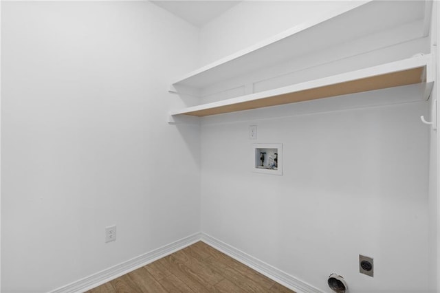 clothes washing area featuring washer hookup, hardwood / wood-style flooring, and electric dryer hookup