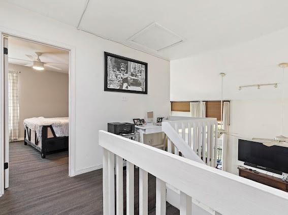 hall with dark hardwood / wood-style floors