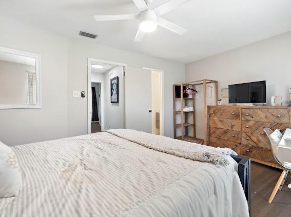 bedroom with ceiling fan and hardwood / wood-style flooring