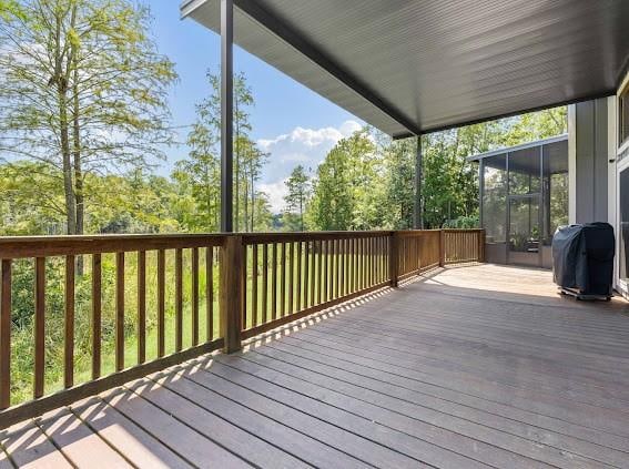 wooden deck featuring area for grilling