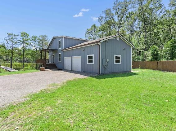 view of property exterior with a lawn