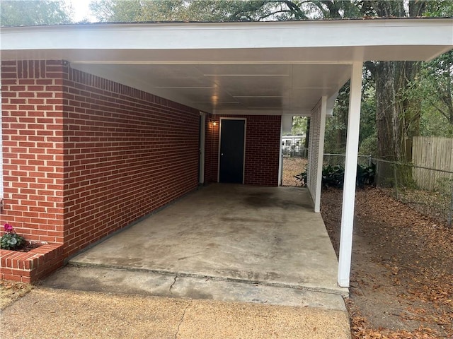 view of vehicle parking featuring a carport