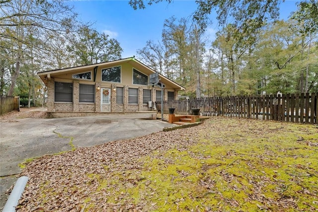 view of side of home featuring a patio area