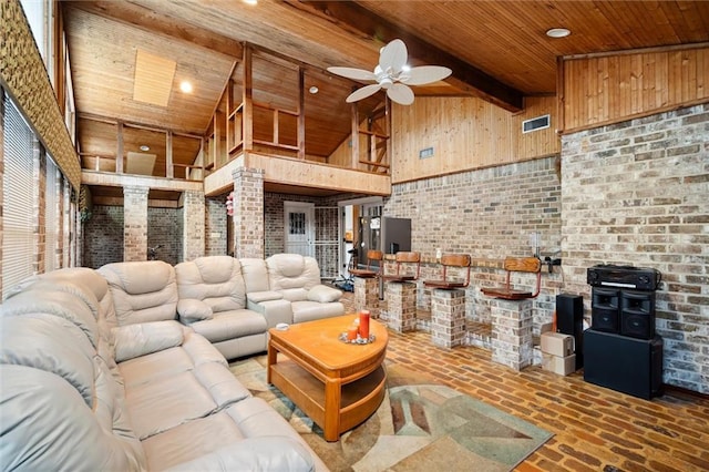 living room featuring beamed ceiling, ceiling fan, high vaulted ceiling, and wooden ceiling