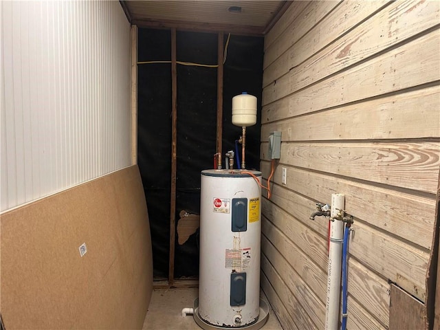 utility room featuring electric water heater