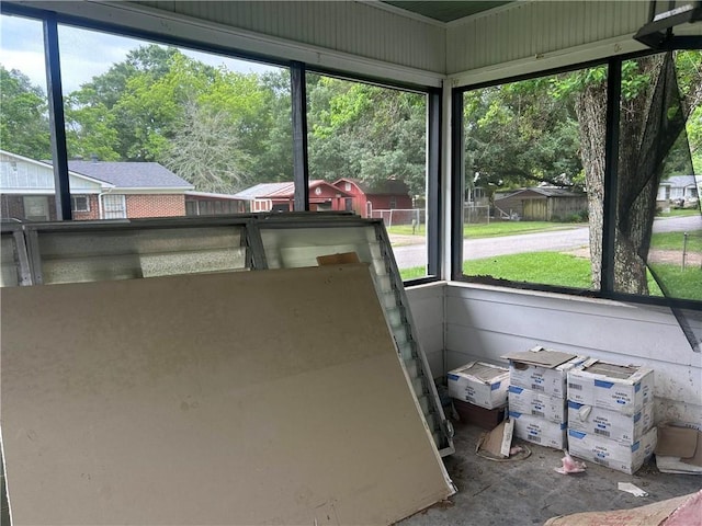 sunroom / solarium featuring healthy amount of natural light