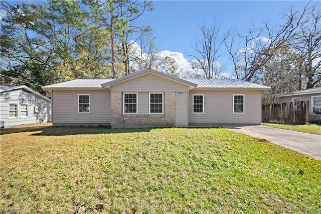 ranch-style house with a front lawn