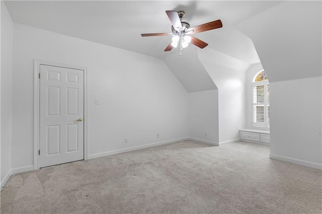 bonus room with ceiling fan, light colored carpet, and lofted ceiling