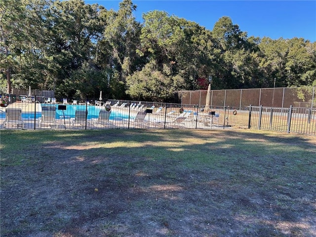 view of yard featuring a community pool