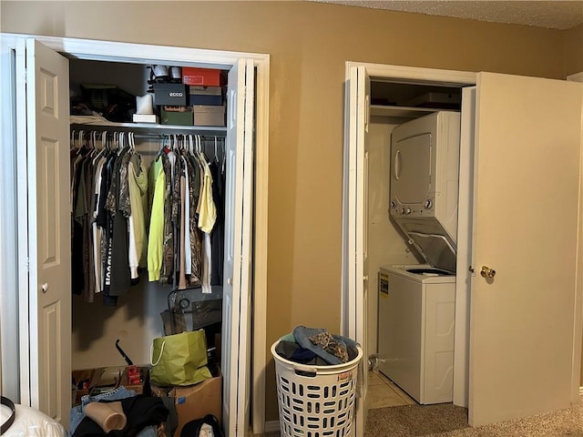 closet with stacked washer and dryer