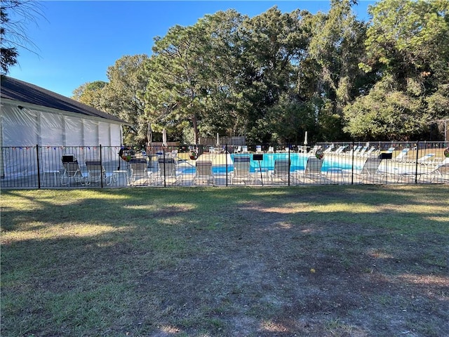 view of yard featuring a community pool