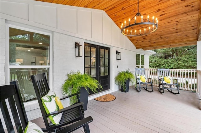 wooden terrace with a porch