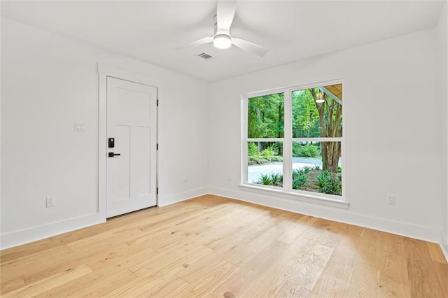 spare room with ceiling fan and light hardwood / wood-style floors