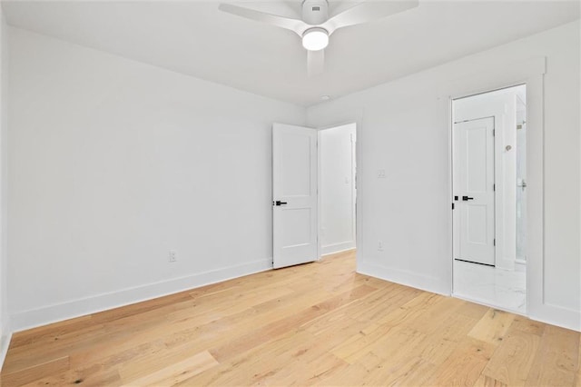 spare room featuring ceiling fan and wood-type flooring