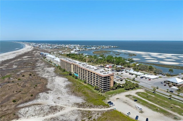 bird's eye view featuring a water view and a beach view