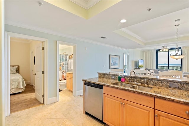 kitchen featuring light stone counters, a sink, stainless steel dishwasher, and ornamental molding