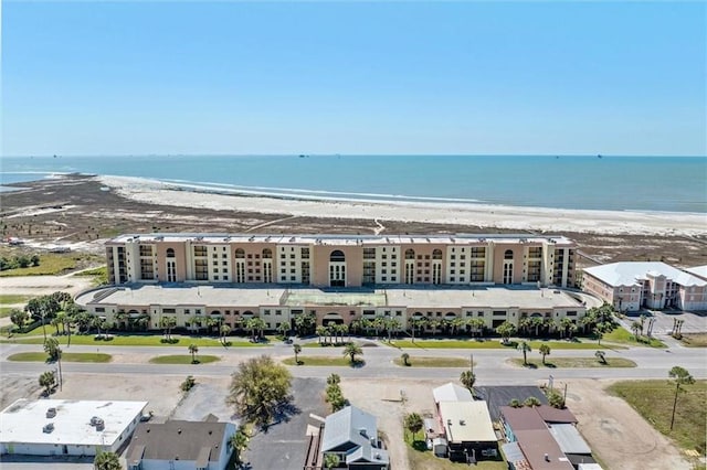 aerial view with a water view and a view of the beach