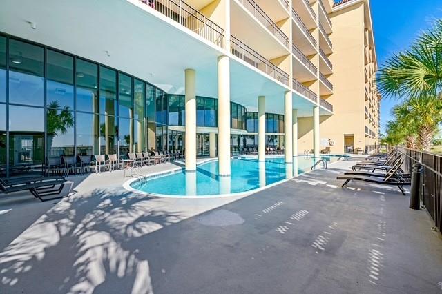 community pool with a patio area