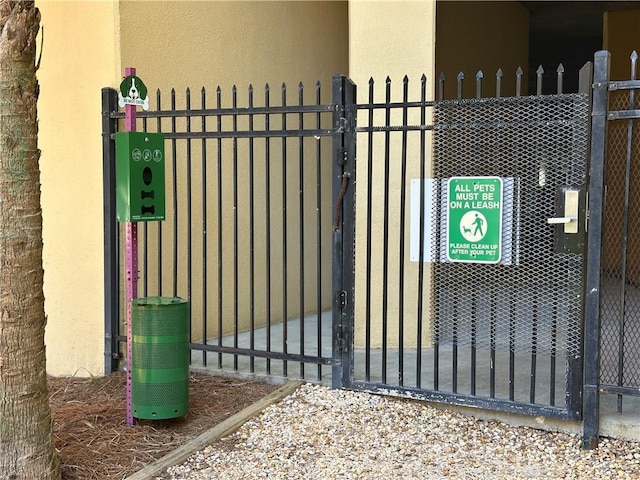 view of gate with fence