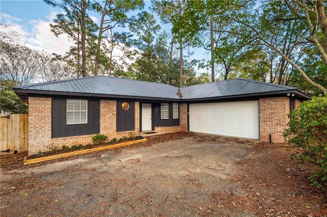 ranch-style home featuring a garage