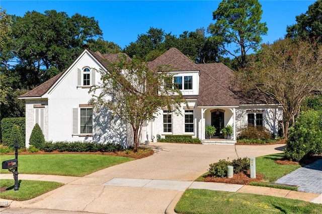 view of front of property with a front lawn