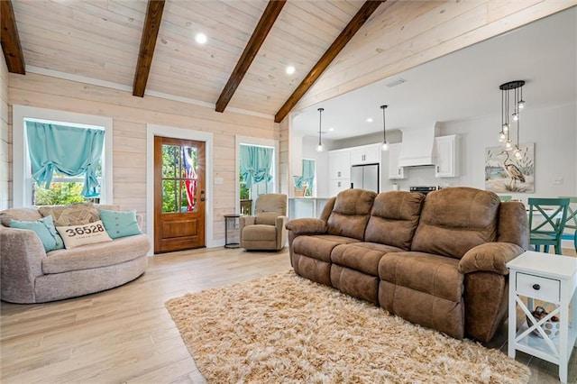 living room featuring high vaulted ceiling, wood ceiling, light hardwood / wood-style floors, beam ceiling, and wood walls