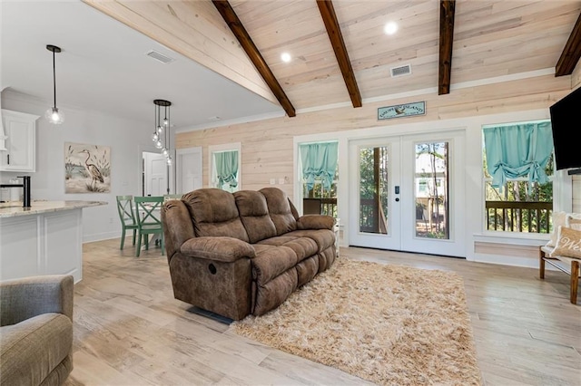 living room featuring french doors, vaulted ceiling with beams, wood ceiling, and light hardwood / wood-style floors