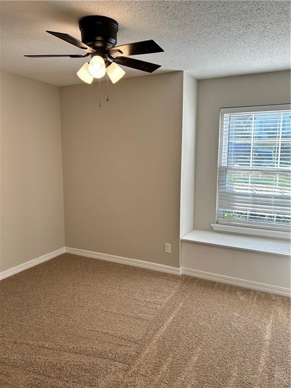 3120 Wellborne Dr W, Mobile, AL 36695 - carpeted spare room with a textured ceiling, baseboards, and ceiling fan