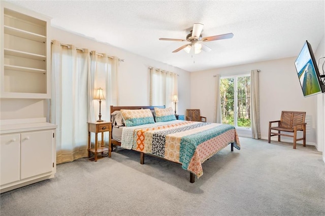 bedroom featuring light carpet and ceiling fan