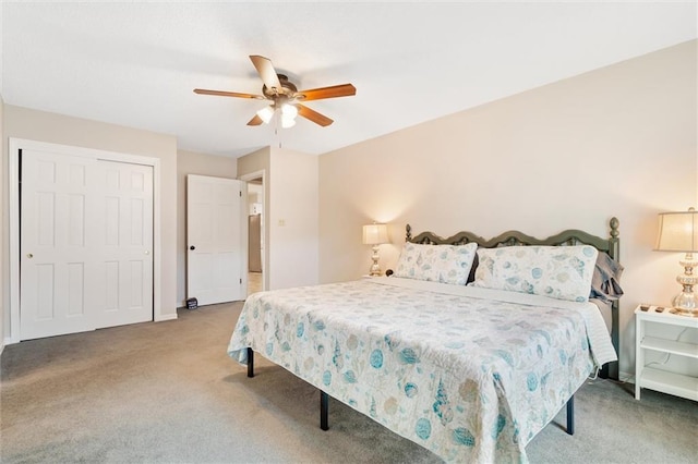 carpeted bedroom with a closet, ceiling fan, and baseboards