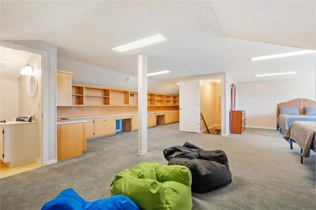 interior space featuring lofted ceiling, light colored carpet, and baseboards