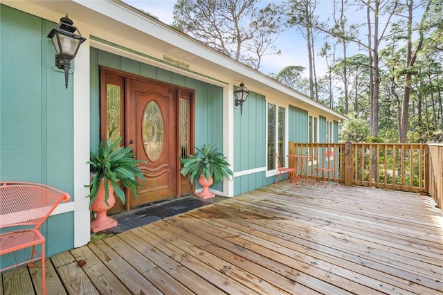 entrance to property with a wooden deck