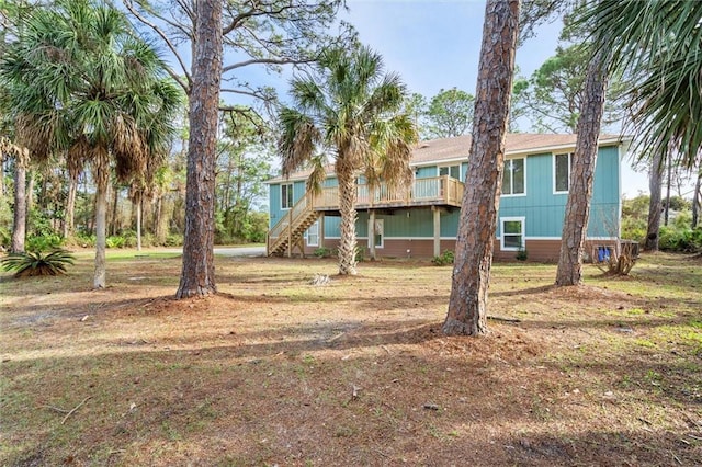 rear view of property with stairs