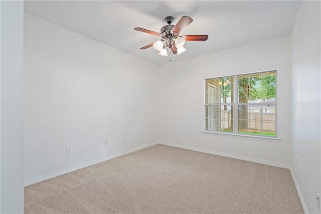 unfurnished room with light carpet and ceiling fan