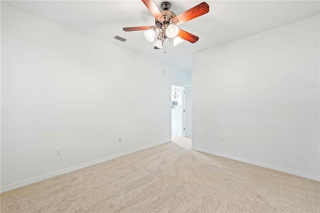 empty room with light carpet and ceiling fan