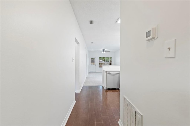 hall with dark wood-type flooring