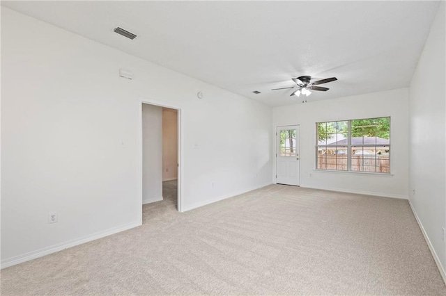 carpeted empty room with ceiling fan