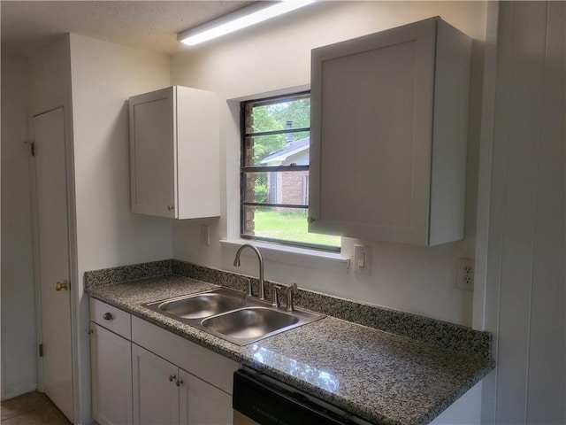 6290 Quail Ct, Theodore, AL 36582 - kitchen with a sink, dishwasher, dark countertops, and white cabinets