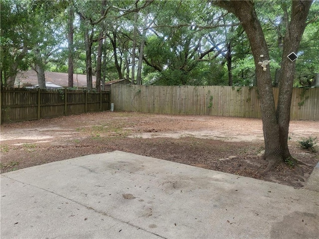 6290 Quail Ct, Theodore, AL 36582 - fenced backyard featuring a patio area